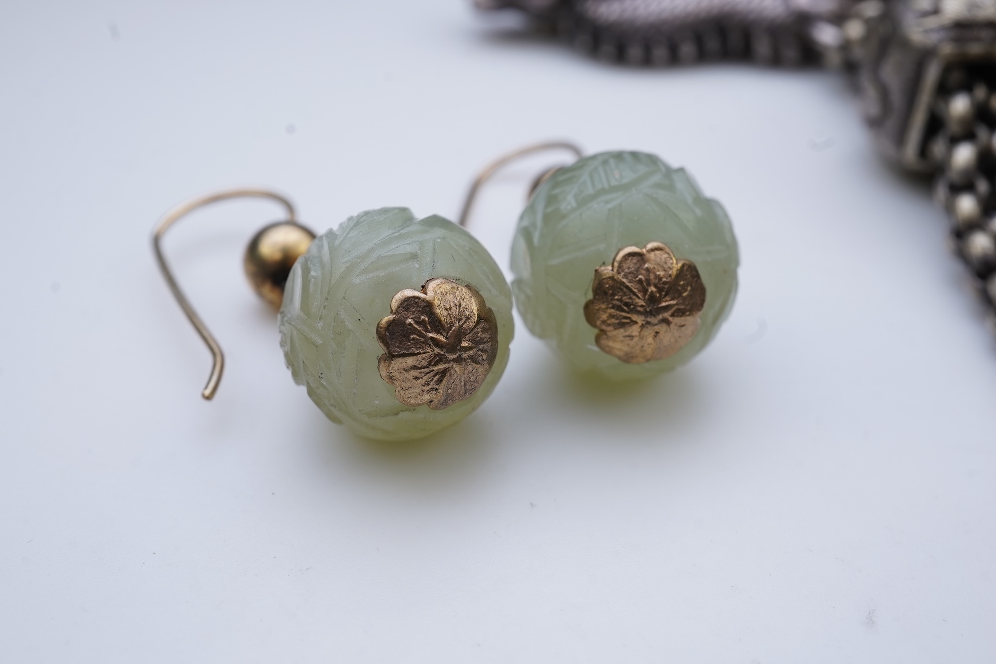 A chatelaine and a pair of serpentine bead earrings
